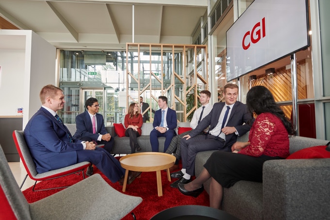 CGI Partners sitting in a group talking A group of CGI Partners sitting together talking