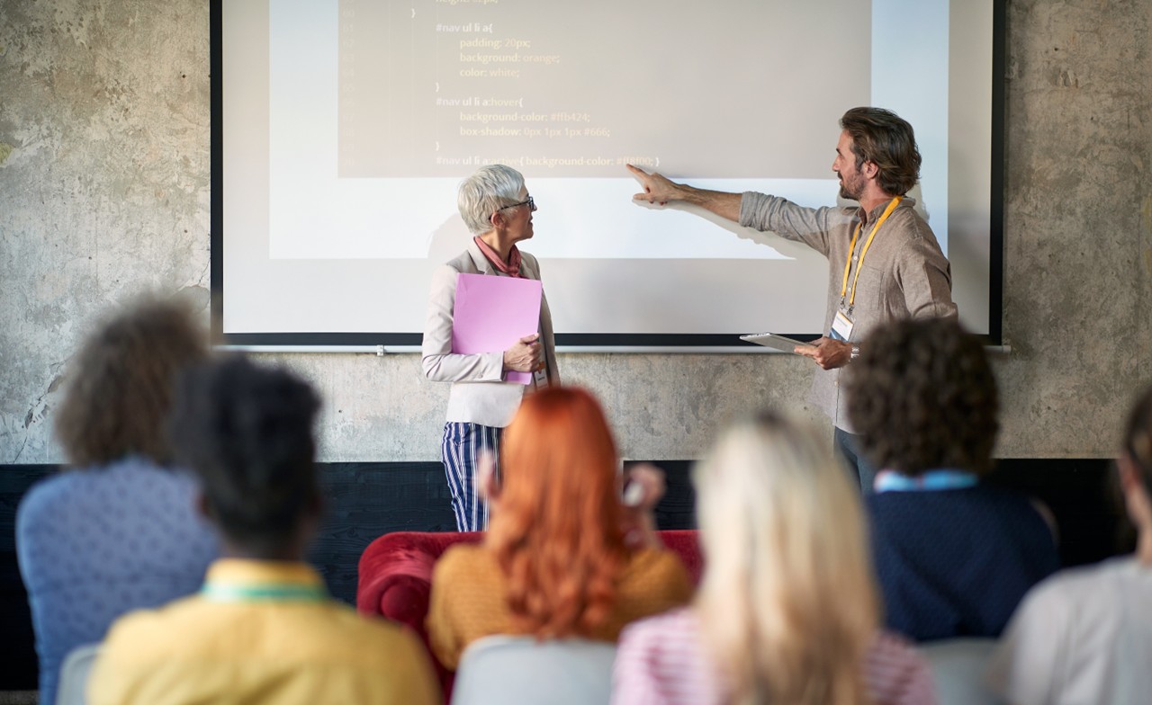two-people-presenting-event Two people presenting at an event
