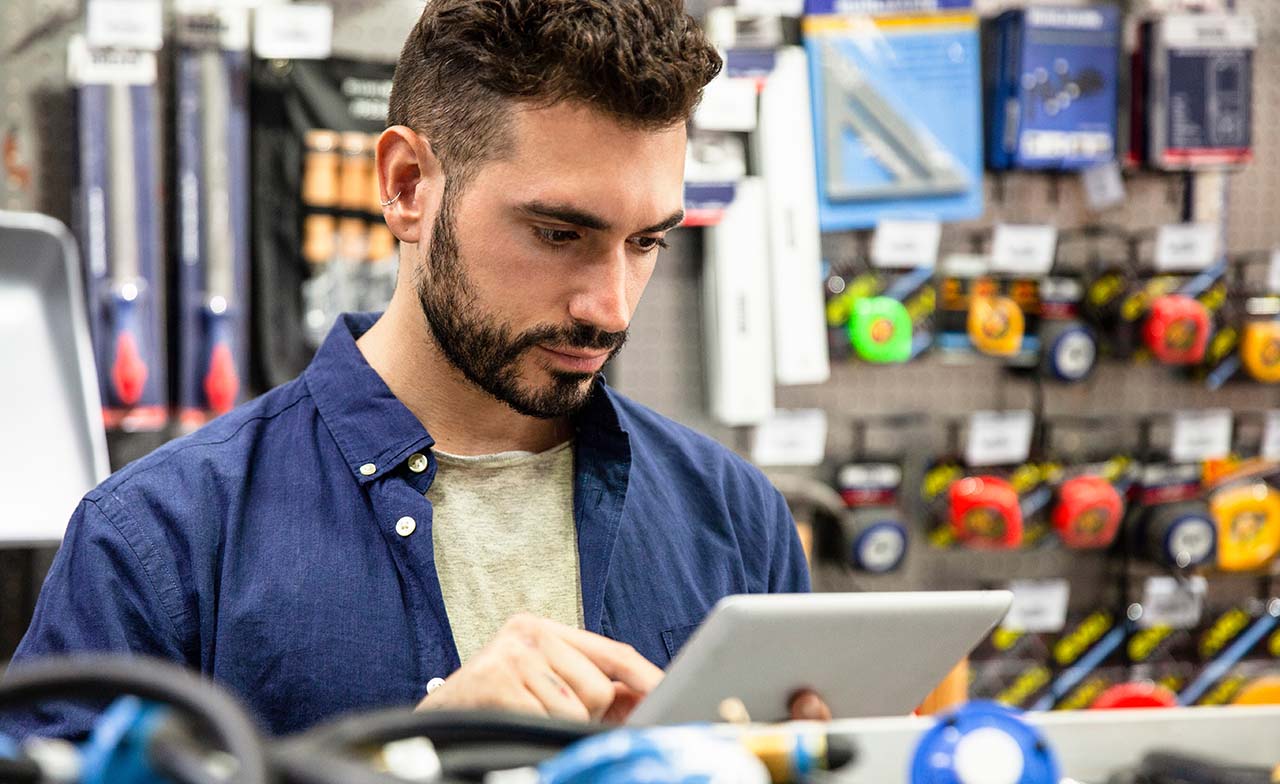 hardware retail store employee working on digital tablet