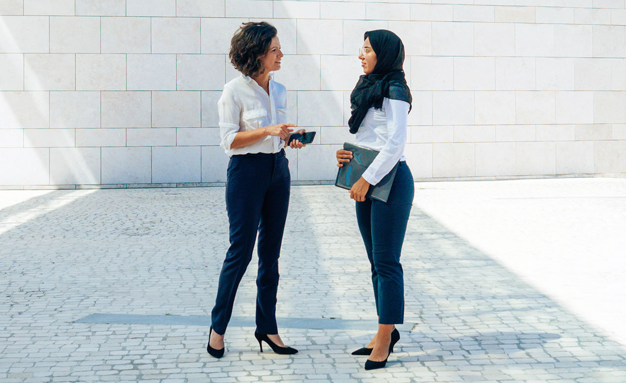 Business women in conversation
