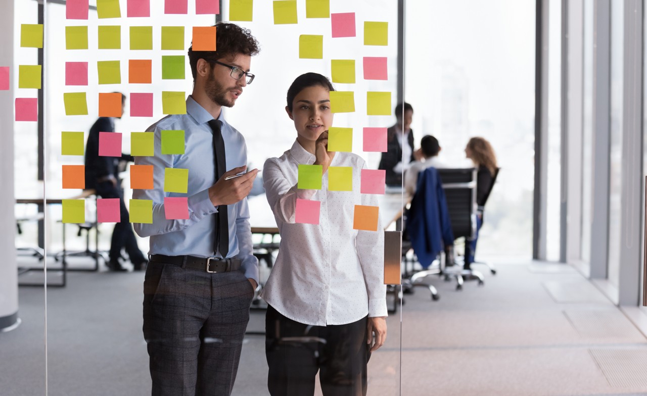 Two employees collaborating together Two employees collaborating together