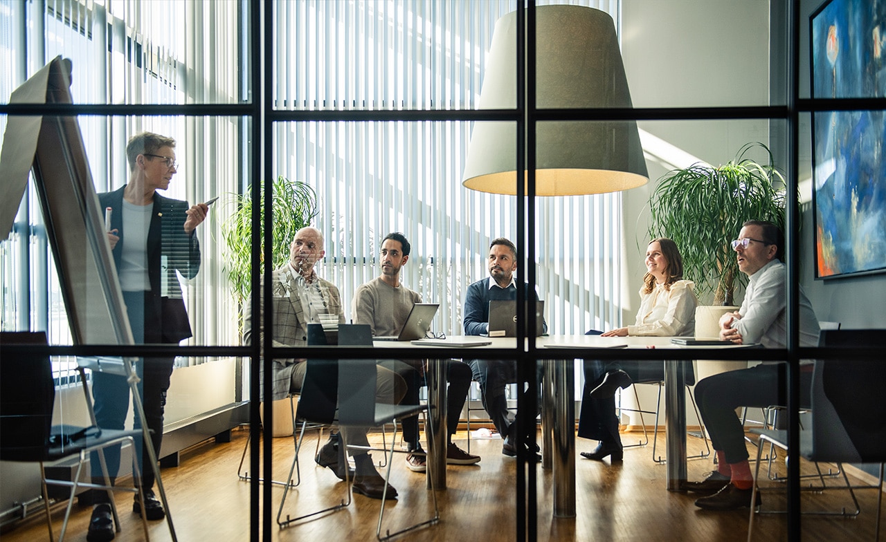 group meeting in a room and discussing work group meeting in a room and discussing work