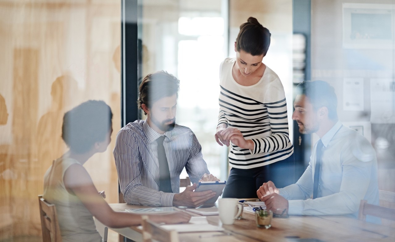 businesspeople-meetingin-conference-room Businesspeople meeting in a conference room
