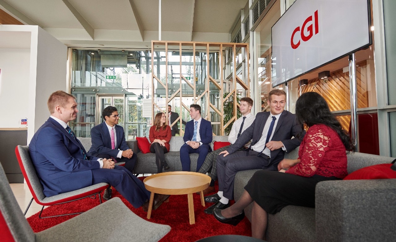 CGI Partners sat on sofa in office CGI Partners sat on sofa in office