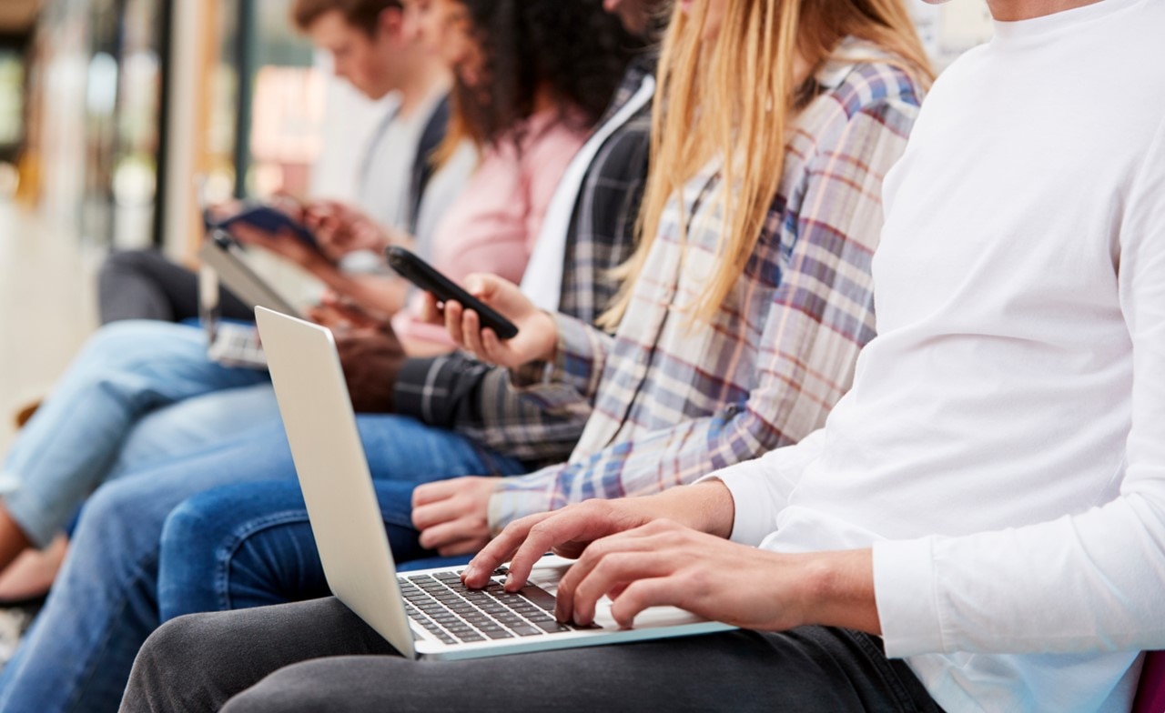 University students using laptop 