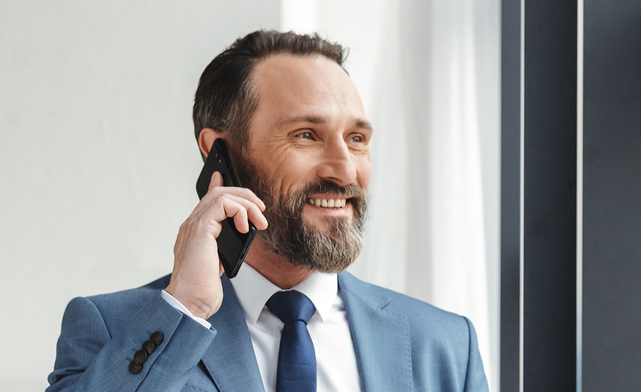 Business man happily discuss about the project success over phone