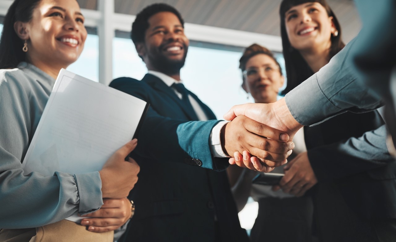 Group of people shaking hands