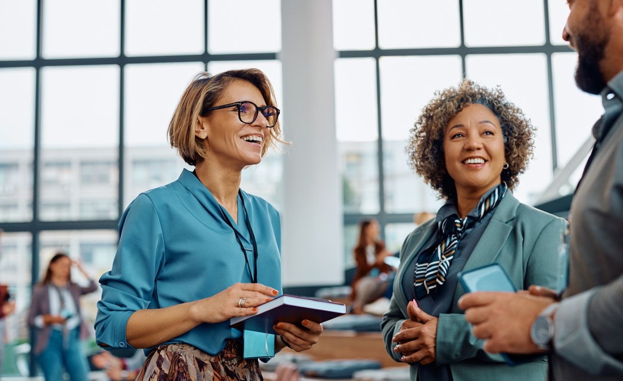 Group of people talking at a business seminar