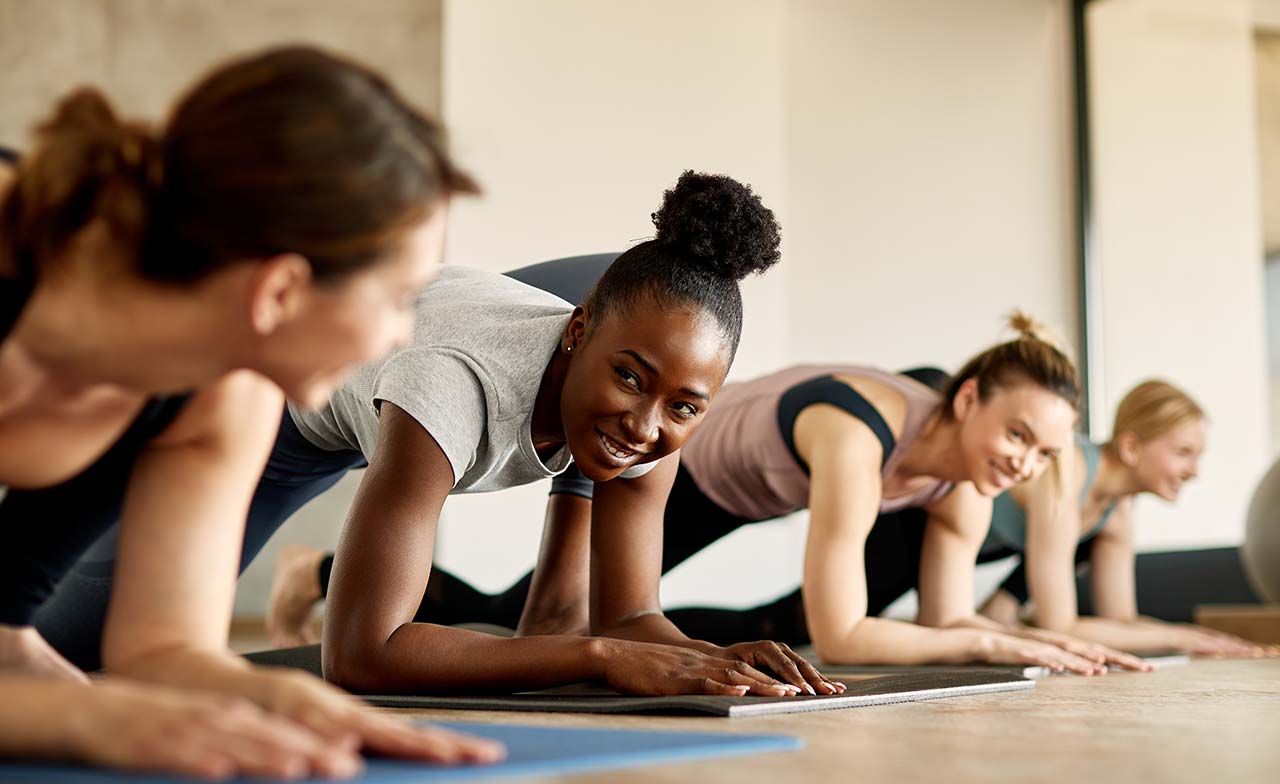 Group of women doing an exercise class for wellbeing 