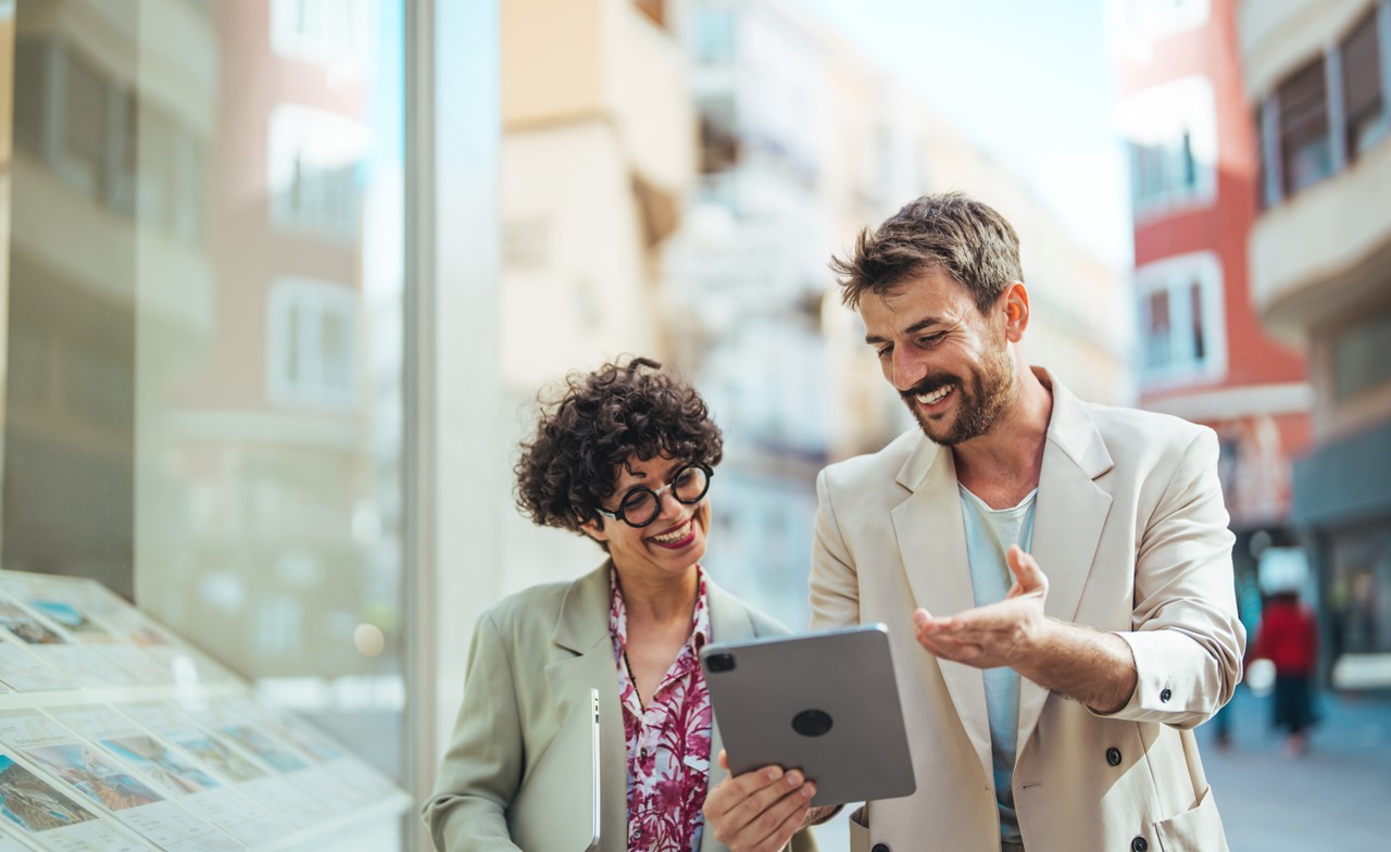 Professionals are on discussion, by looking at a tab