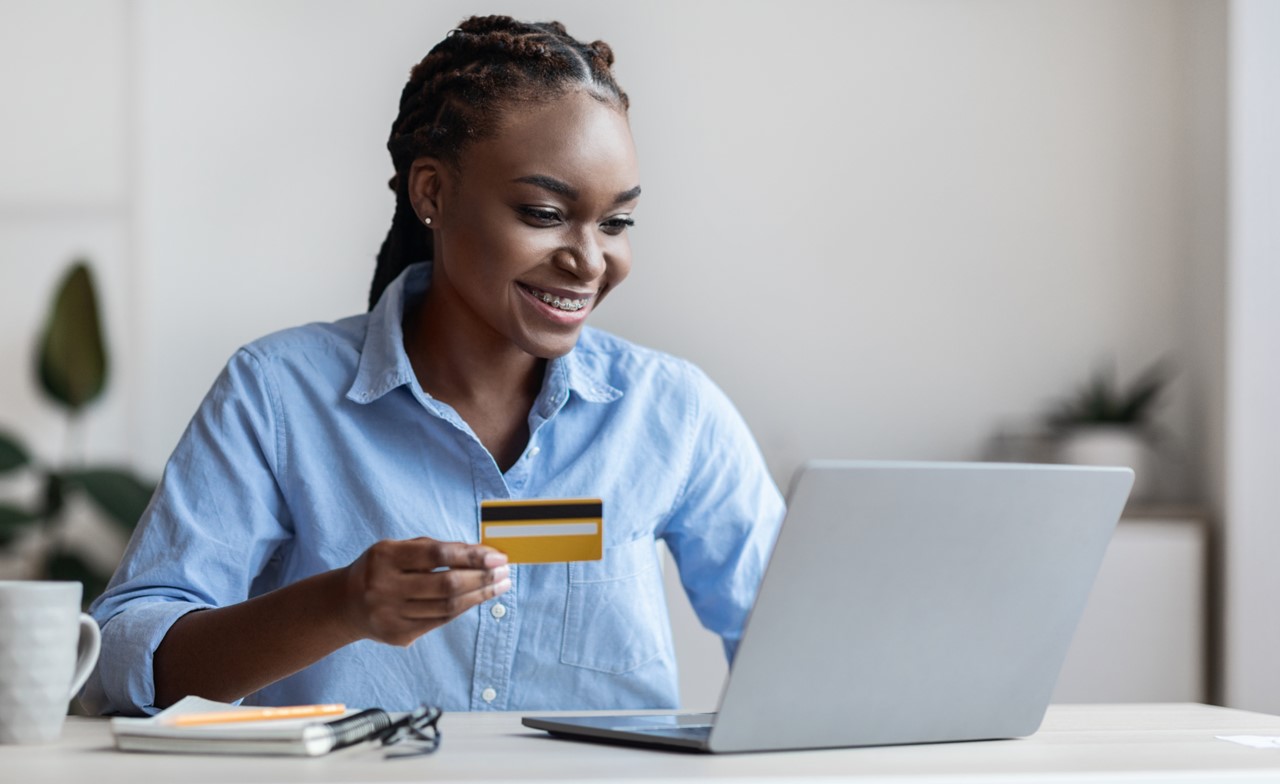 lady paying online with payment card