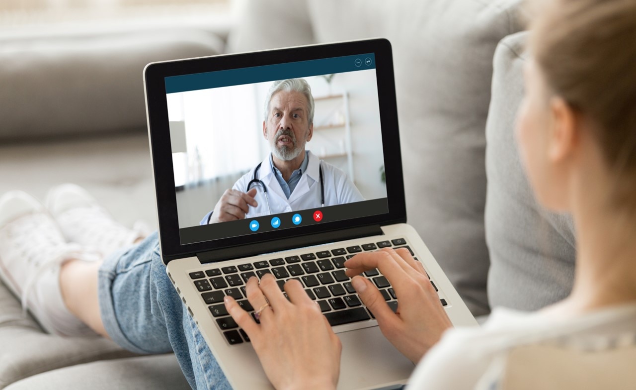 Patient talking to a doctor using a laptop during a telehealth appointment