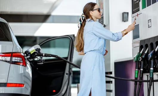 Woman filling fuel by herself