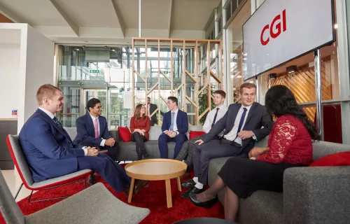 CGI employees meeting in an office lounge