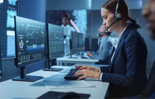 A woman monitoring a project at a control center 