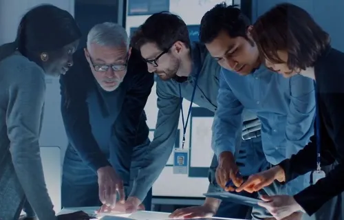 Digital consultants reviewing plans in an office