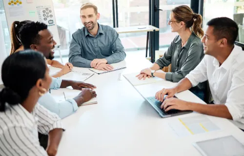 a group of people collaborating in an office environment