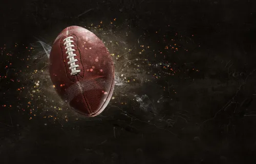 A football in the air with sparkles around it