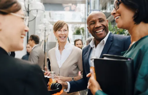 A group of people standing and talking