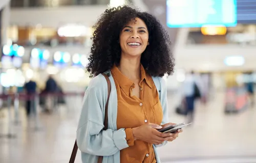 happy young woman at airport