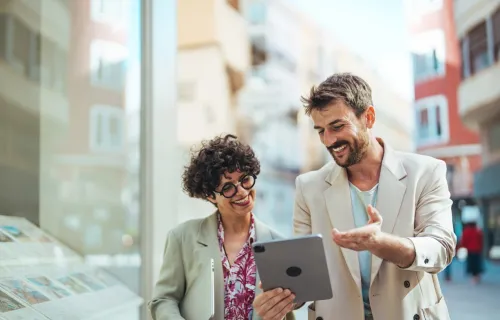 Professionals are on discussion, by looking at a tab