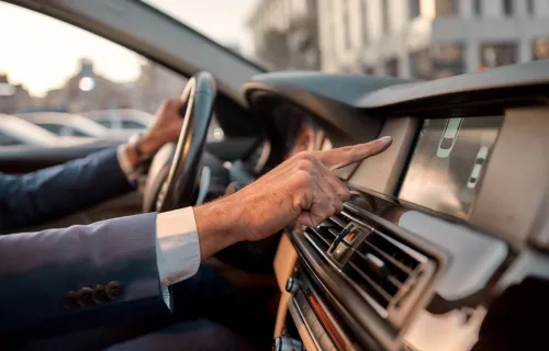 Man using parking assist system in a car