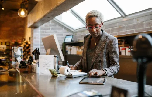 Woman retailer checking on a device