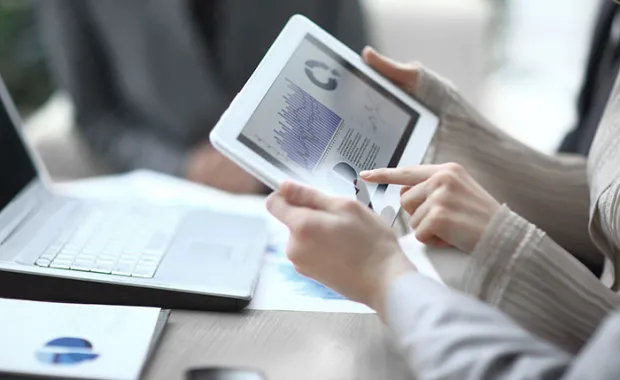 Business team using a digital tablet