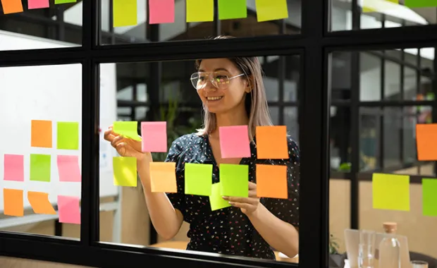 Female scrum master organizing project working process