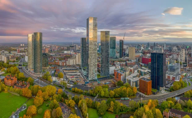 Aerial view of Manchester skyline at sunset