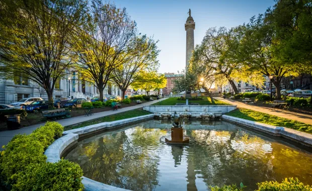 A view of a fountain in a park in Baltimore, MD