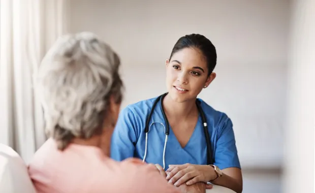 Healthcare professional talking to patient