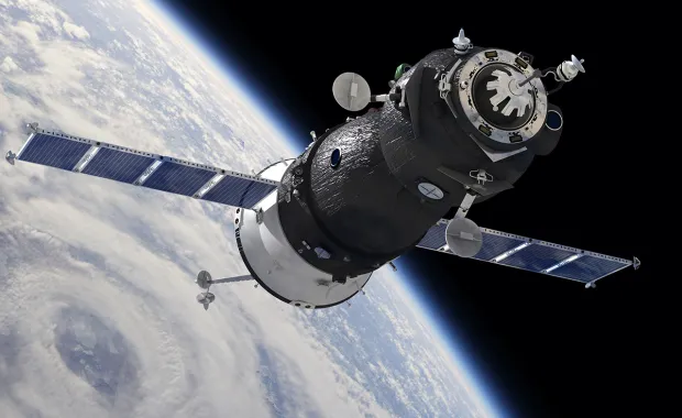 un satellite orbite autour de la Terre, représentant le travail de CGI sur les missions d’engins spatiaux