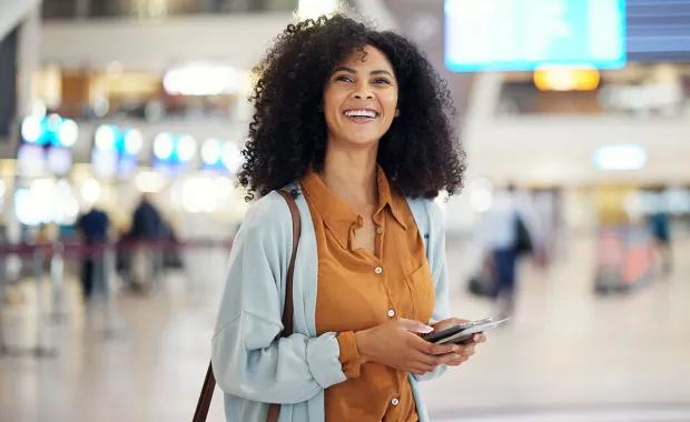 Woman happy laughing at airport