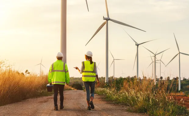 workers in high vis jackets at wind farm