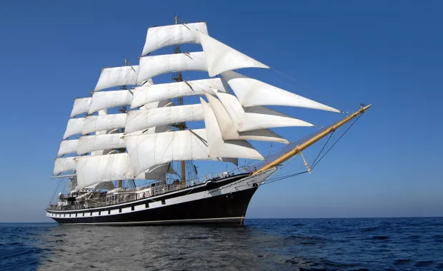 A large sailing ship on the ocean