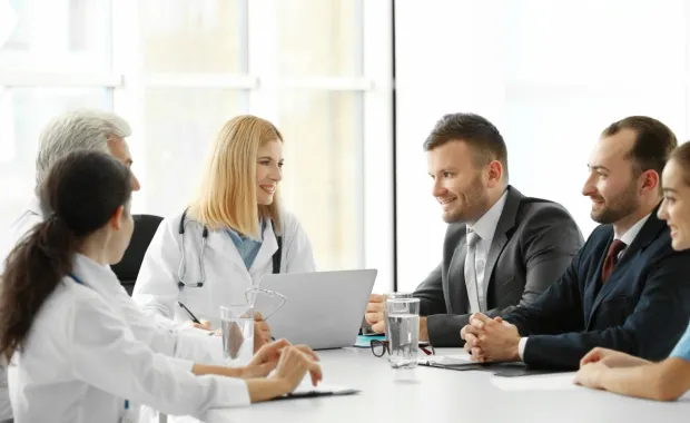 Medical professionals meeting in a boardroom