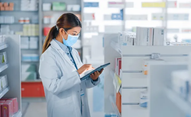Pharmacist uses digital tablet computer
