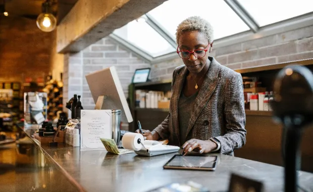 Woman retailer checking on a device