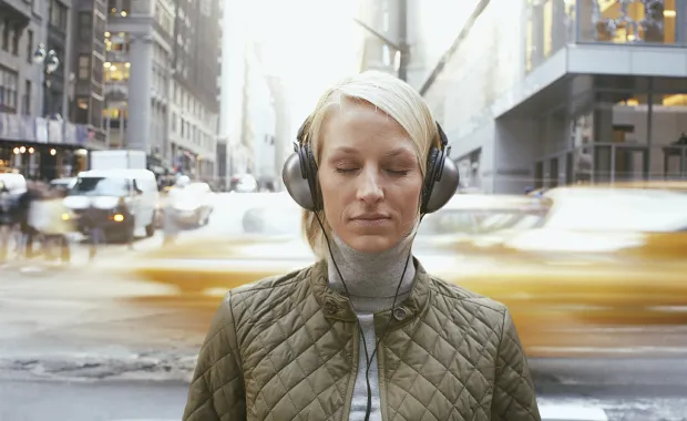 woman wearing noise canceling headphones