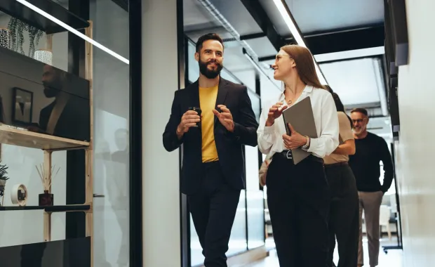 young professiionals discussing business in an office setting