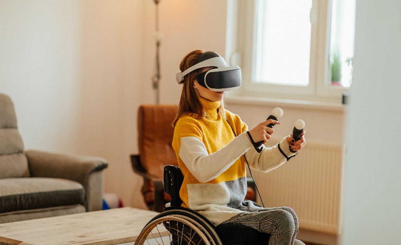 Woman in wheelchair using VR headset